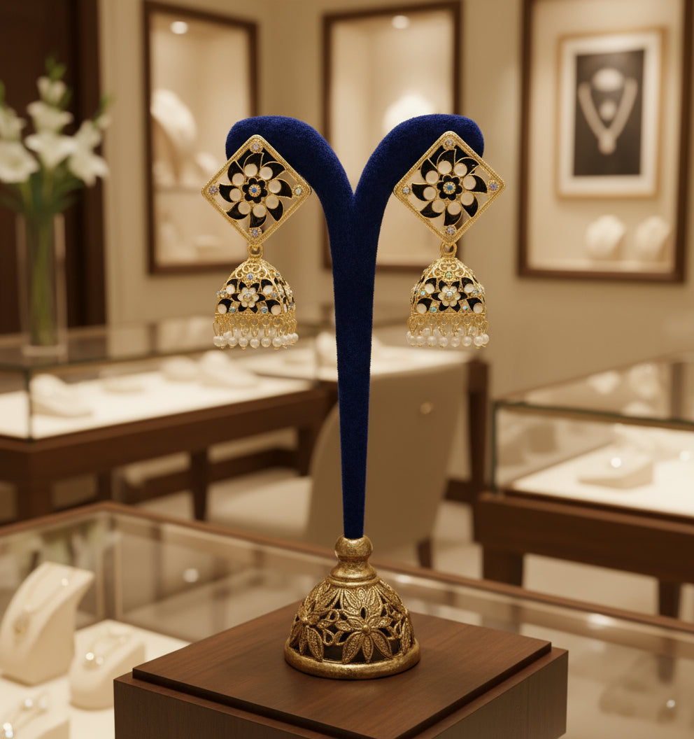 A pair of gold-plated brass Meenakari stud Jhumka earrings with green and white stones.