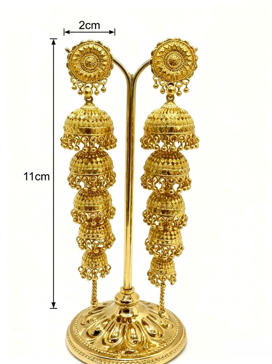 Pair of 5-tier cascading gold jhumka dangle earrings on gold display stand, dimensions: length 11cm, width 2cm, ornate rosette top, five graduated filigree domes, premium gold-plated traditional South Asian bridal jewelry, white background.