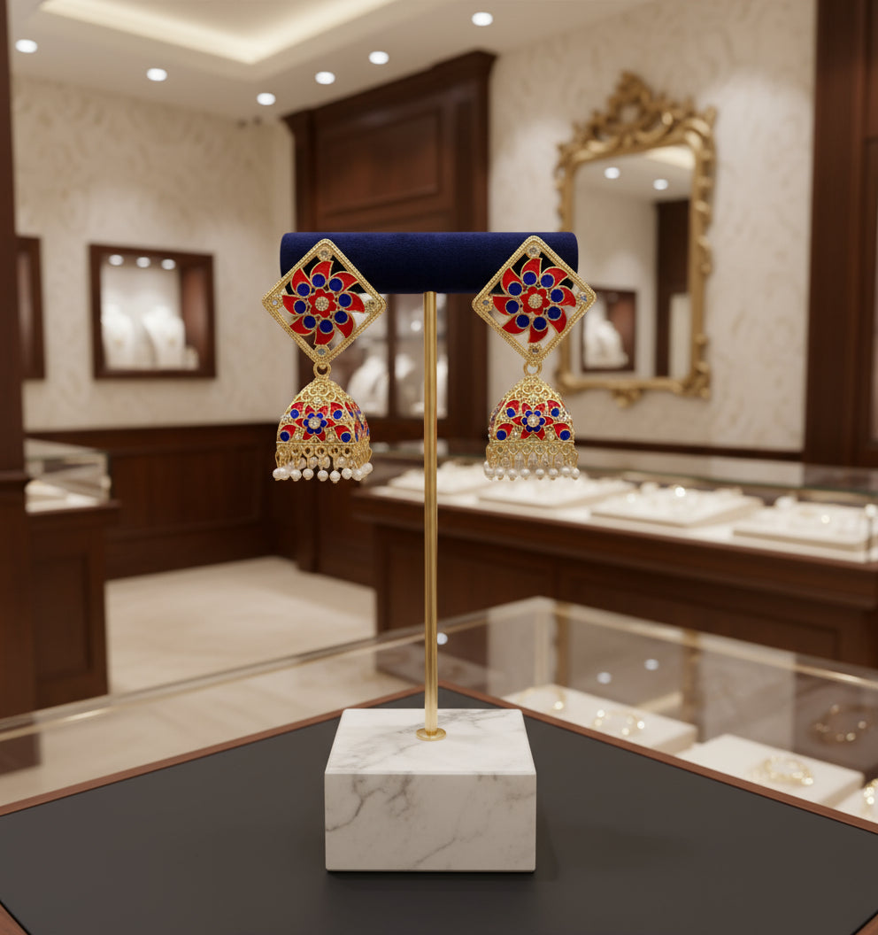 A pair of gold-plated brass Meenakari stud Jhumka earrings with green and white stones.