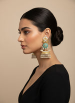 A pair of silver long Jhumkas with intricate designs and small pearls hanging from the bottom.