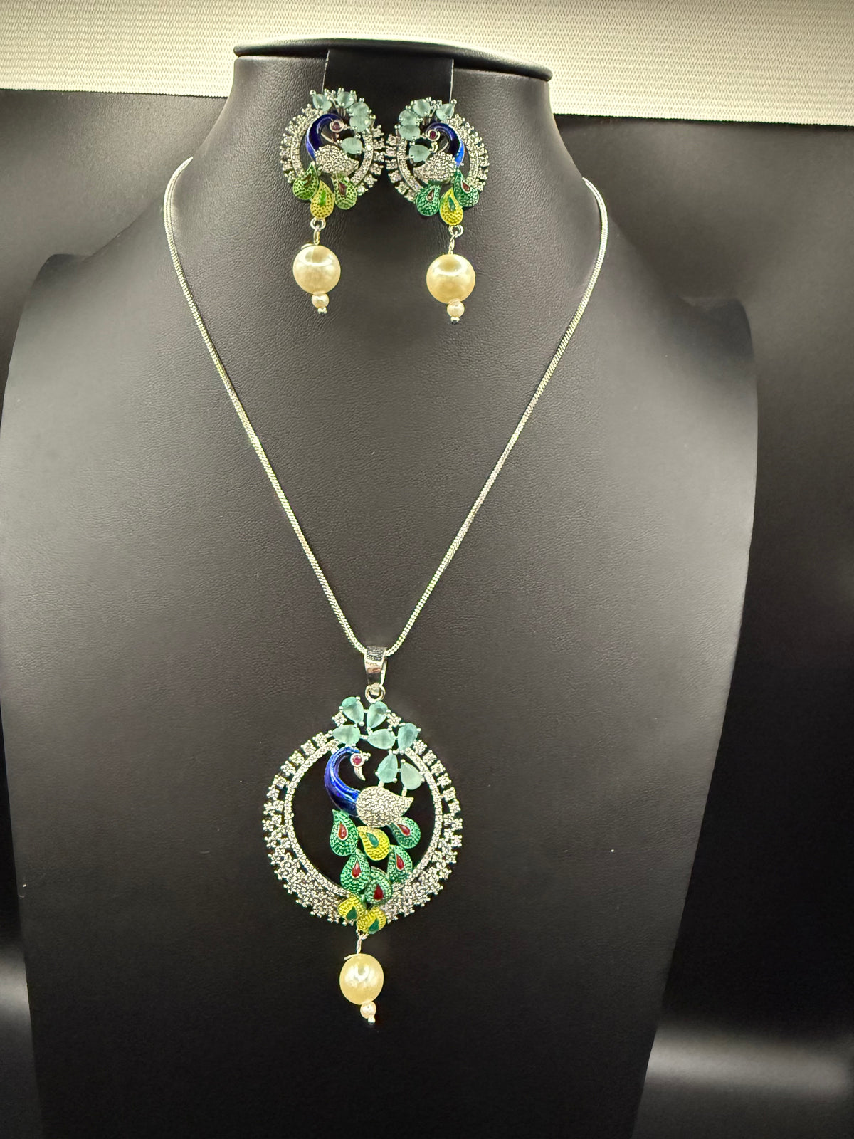 Peacock Pendants Set with earrings | Peacock sitting on swing– Famaza Couture