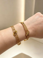 The Aurelia Interlocking Gold-Plated Sculptural Bangles