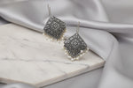 A close-up-of-intricate-tribal-carvings-on-oxidized-jewellery