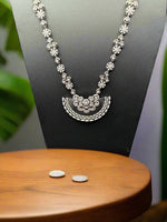 Gold plated floral necklace and earrings set with white accents