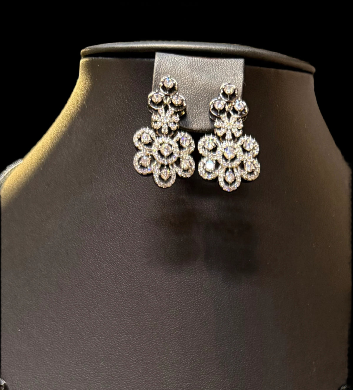 Gold plated floral necklace and earrings set with white accents