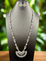 Gold plated floral necklace and earrings set with white accents