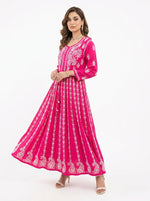 A Model is showing the front view of this Hot Pink chikankari hand embroidered Aanarkali long dress.