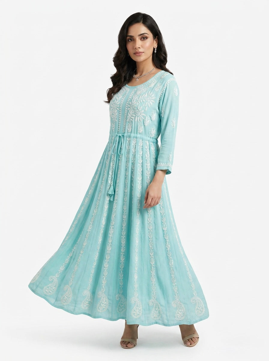 A Model is showing the front view of this sky blue chikankari hand embroidered Aanarkali long dress.