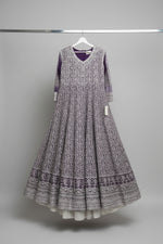 A Purple floor length bridal tail maxi dress with fully machine zari work all over the maxi dress