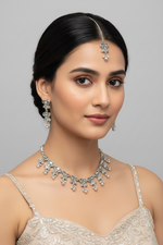 The Silver jewellery set with choker necklace, earrings and maang tikka