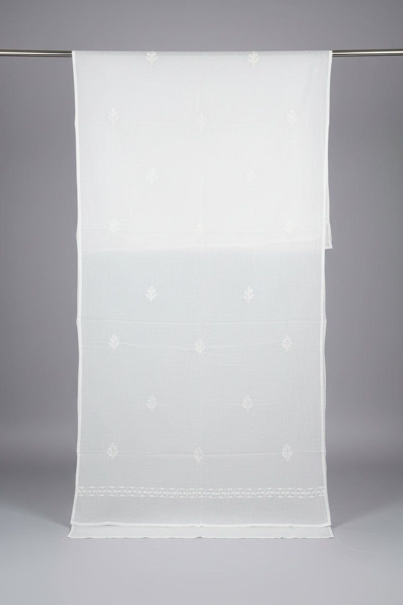A White lawn fabric shawl is displayed with white silk thread hand embroidery on the both side borders and small flowers on all over the shawl.