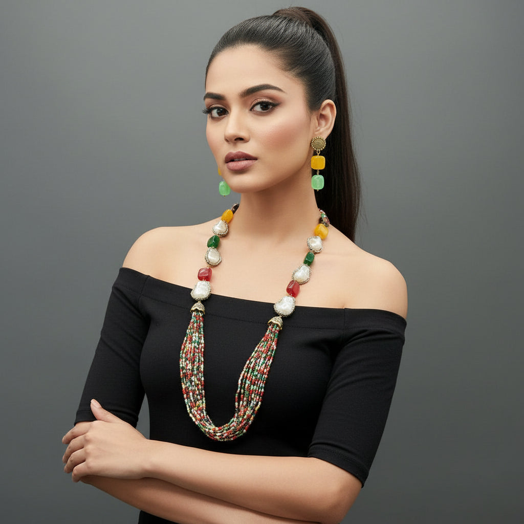 A black mannequin showcasing a Bollywood style Mona Lisa stone and crystal beaded Mala set, with multiple colours of beads and gold-tone accents.