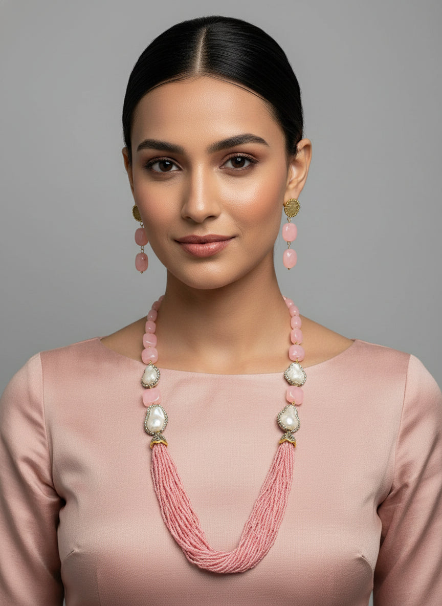 A black mannequin showcasing a Bollywood style Mona Lisa stone and crystal beaded Mala set, with pink colour of beads and gold-tone accents.