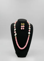 A black mannequin showcasing a Bollywood style Mona Lisa stone and crystal beaded Mala set, with pink colour of beads and gold-tone accents. Party wear jewellery set.