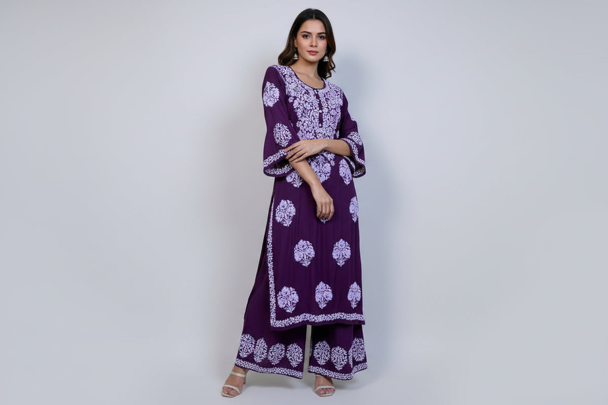 A floral embroidered purple kurta set with palazzo trousers.