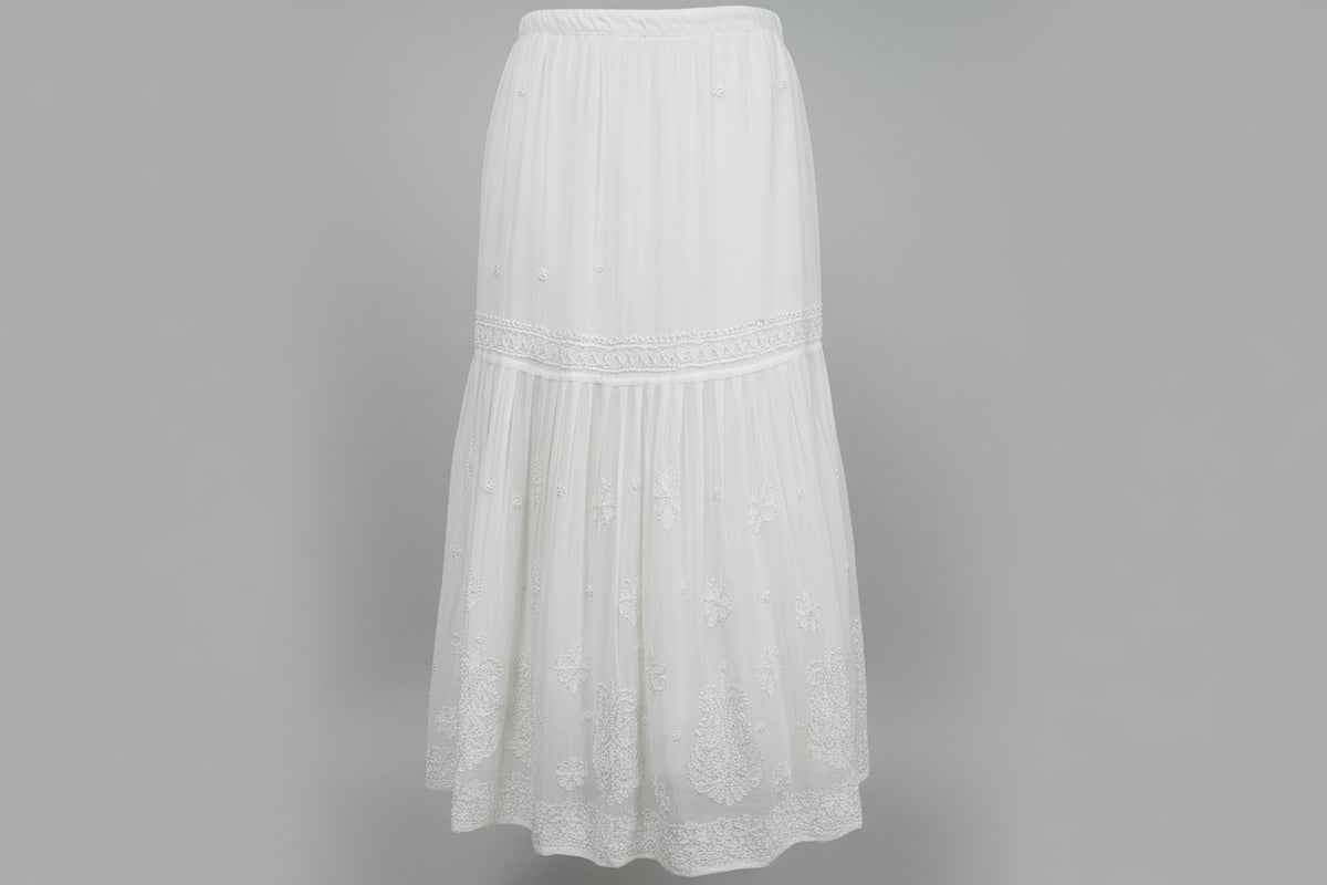 A focus image of a white flared hand embroidered gharara trousers