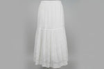 A focus image of a white flared hand embroidered gharara trousers