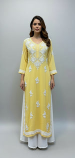 A fully embroidered yellow colour modal fabric kurti with floral Ghass Patti hand embroidery and a full border on display.