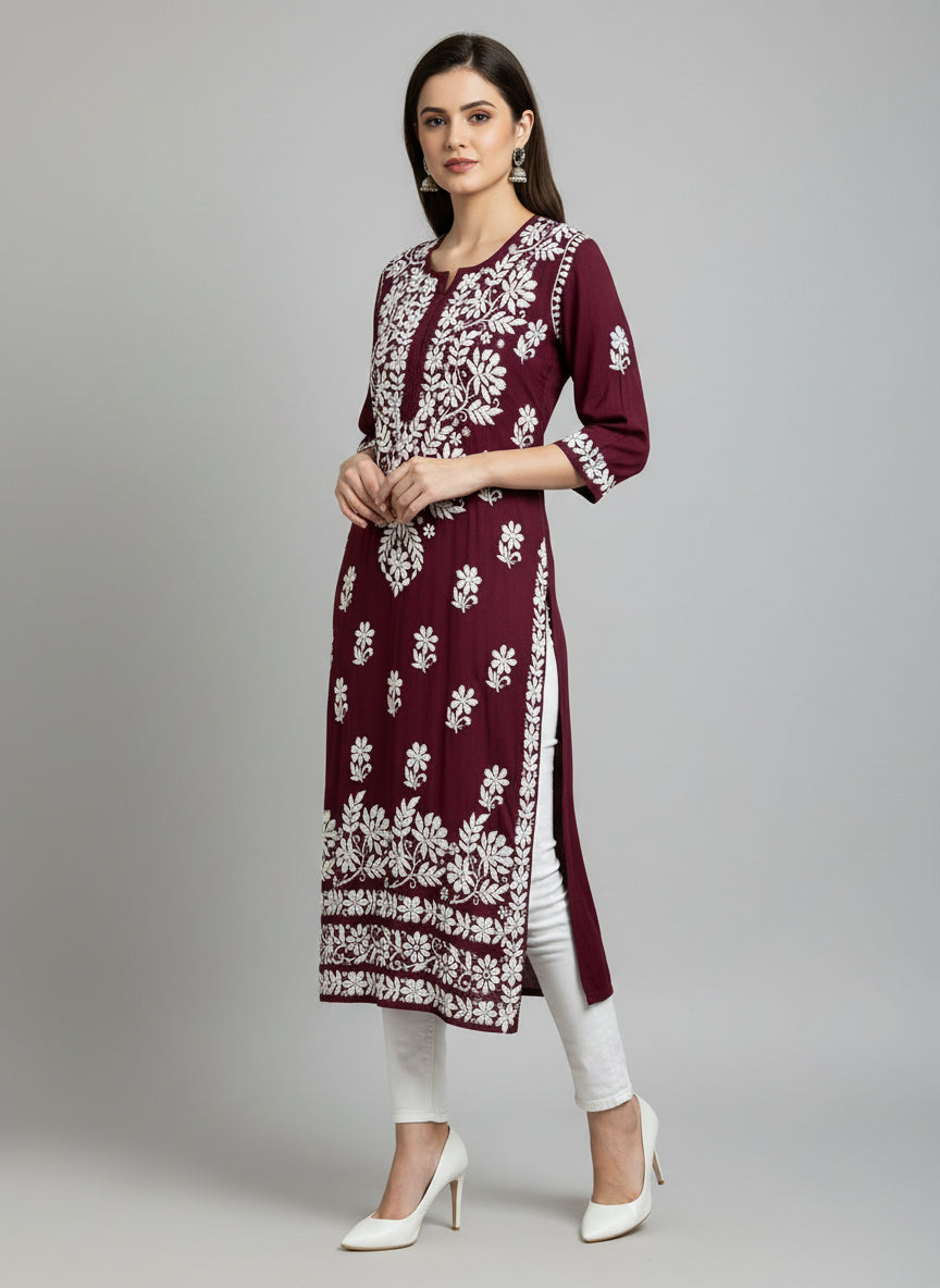 A fully hand embroidered Maroon colour modal fabric 46 inches long kurti with white floral motifs and detailed border work.