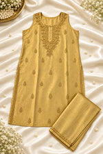 A gold-coloured traditional Indian salwar suit set consisting of a sleeveless kurta with embroidered neckline and matching trousers, laid flat on a white satin sheet.