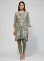 A green colour georgette kurti with floral chikankari printed and hand embroidered motifs.