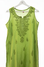 A lime green sleeveless kurta with dark green floral embroidery on the chest and scattered motifs on the fabric, shown hanging on a white hanger.