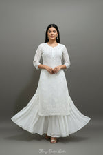 A long, white viscose fabric kurti with ghasspati hand-embroidered Chikankari patterns by famaza couture