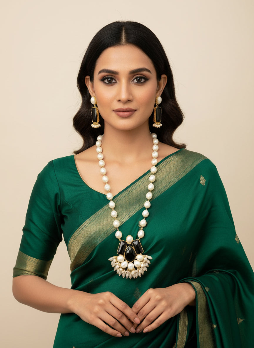 A luxury Bollywood style Mala Set featuring white beads, pearls, and black stones inclusions, displayed on a mannequin bust. Party wear mala set.