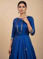 A luxury Tanjore Art Meenakari beaded Mala Set, featuring a regal bridal necklace and matching earrings with blue and gold details.