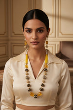 A luxury Tanjore Art Meenakari beaded Mala Set, featuring a regal bridal necklace and matching earrings with yellow and gold details.