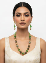 A luxury Tanjore Art Meenakari hot apple green beaded Mala Set, featuring a regal bridal necklace and matching earrings with green and gold details. Paty wear set. Party wear set.