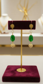 A luxury Tanjore earrings with green and gold details. Paty wear earrings.