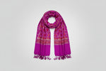 A magenta Kashmiri embroidered pashmina scarf with tassels on the ends, featuring intricate geometric and floral patterns.