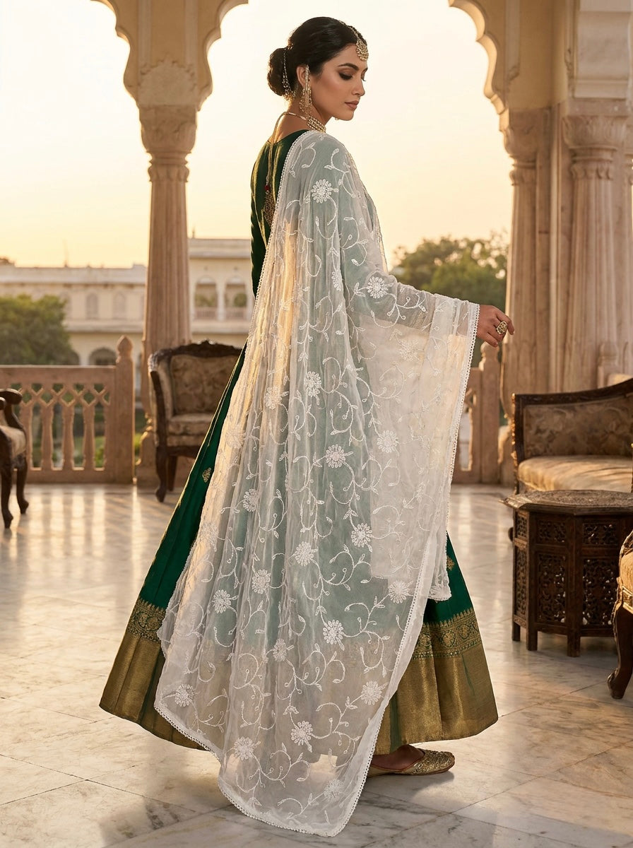 A model is displaying the white chiffon dupatta with Kashmiri aari jaal embroidery all over the dupatta