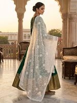 A model is displaying the white chiffon dupatta with Kashmiri aari jaal embroidery all over the dupatta