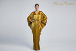 A mustard colourvelvet long kaftan dress displayed on a mannequin, featuring batwing sleeves design withV-neckline.
