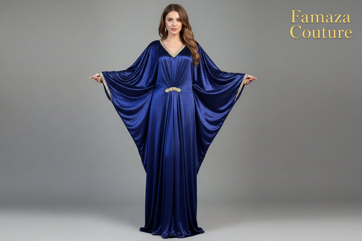 A navy blue velvet long kaftan dress displayed on a mannequin, featuring batwing sleeves design withV-neckline.