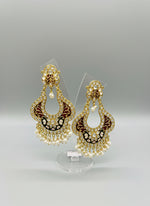A pair of gold-toned chandbali earrings with maroon and black minakari and kundan studded details along with pearls. Party wear.