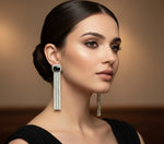 A pair of silver finish cubic zirconia drop earrings with Black doublet semi precious stones. Party wear earrings.