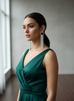 A pair of silver finish cubic zirconia drop earrings with Maroon doublet semi precious stones. Party wear earrings.