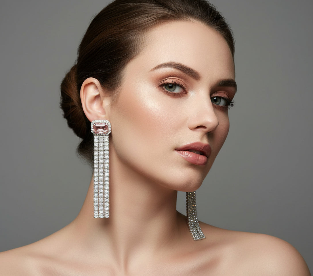 A pair of silver finish cubic zirconia drop earrings with Pink doublet semi precious stones. Party wear earrings.