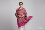 A pink Kashmiri embroidered pashmina scarf with a traditional geometric pattern, featuring fringes at the ends.