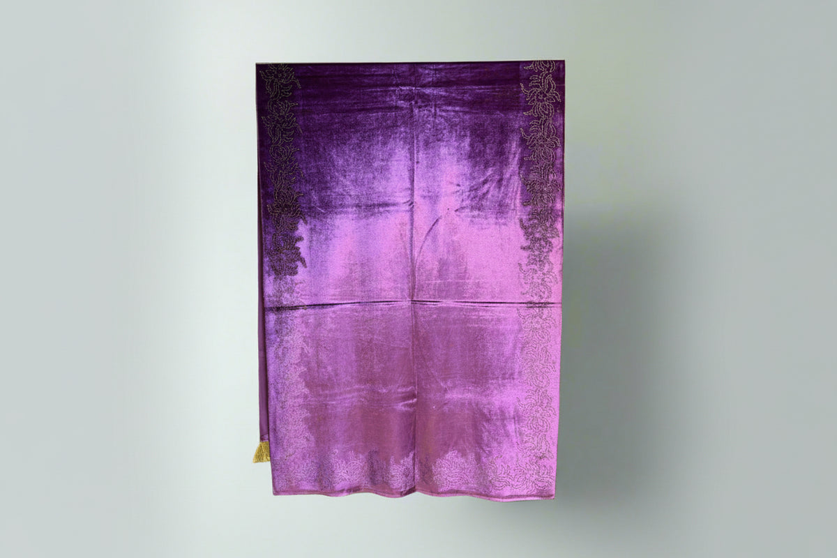 A purple velvet stole with Swarovski crystal embellishments and intricate lace detailing.