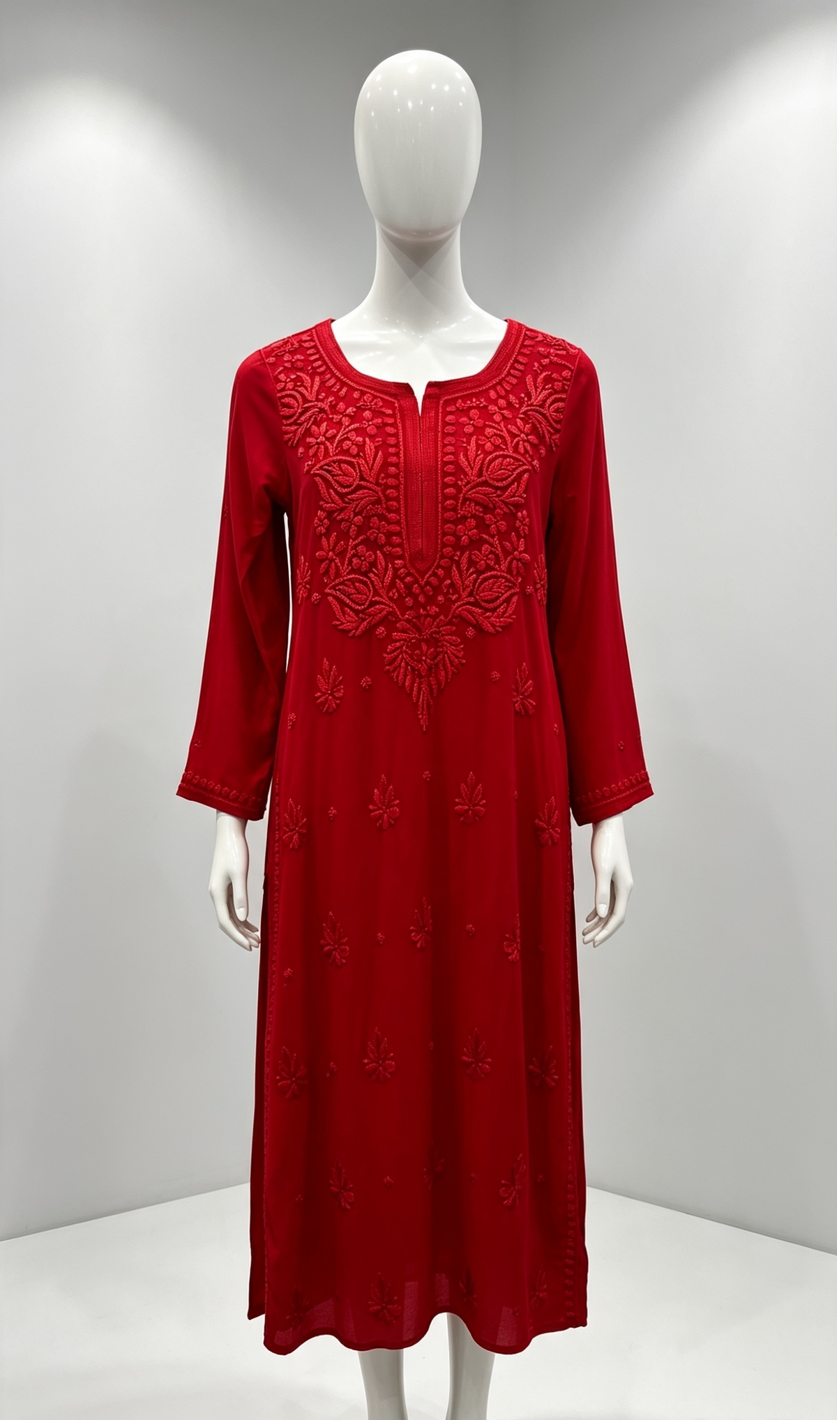 A red long-sleeve viscose kurti with intricate tone red silk thread hand embroidery on the kurti, displayed on a white mannequin in a studio setting.