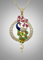 A rhodium-gold plated peacock design pendant with golden chain ,featuring vibrant green, blue, enamel accents, as well as sparkling crystal white and ruby pink stones. Pendant with golden chain design is focused.