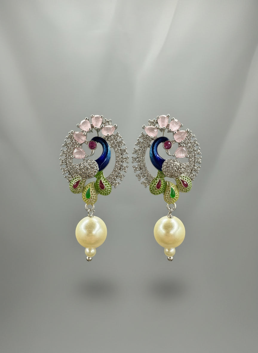 A rhodium-silver plated peacock design accompanied earrings, featuring vibrant green, blue and yellow enamel accents, as well as sparkling white andpink crystal stones. Earrings design is focused.