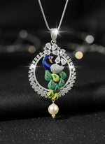 A rhodium-silver plated peacock design pendant with silver chain ,featuring vibrant green, blue, enamel accents, as well as sparkling crystal white AD stones. Pendant with silver chain design is focused.