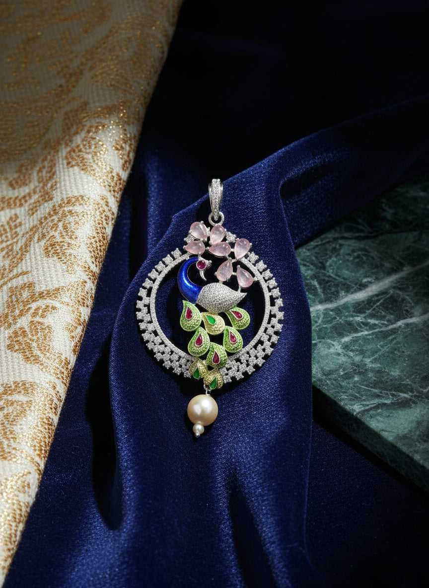 A rhodium-silver plated peacock design pendant with silver chain ,featuring vibrant green, blue, enamel accents, as well as sparkling crystal white and pink stones. Pendant with silver chain design is focused.