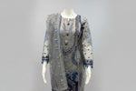 A side view and showing sleeves work of Net fabric in grey and navy blue two tone 3pcs Pakistani dress with hand embellishments on all over kurti and dupatta with plain grey silk straight trousers