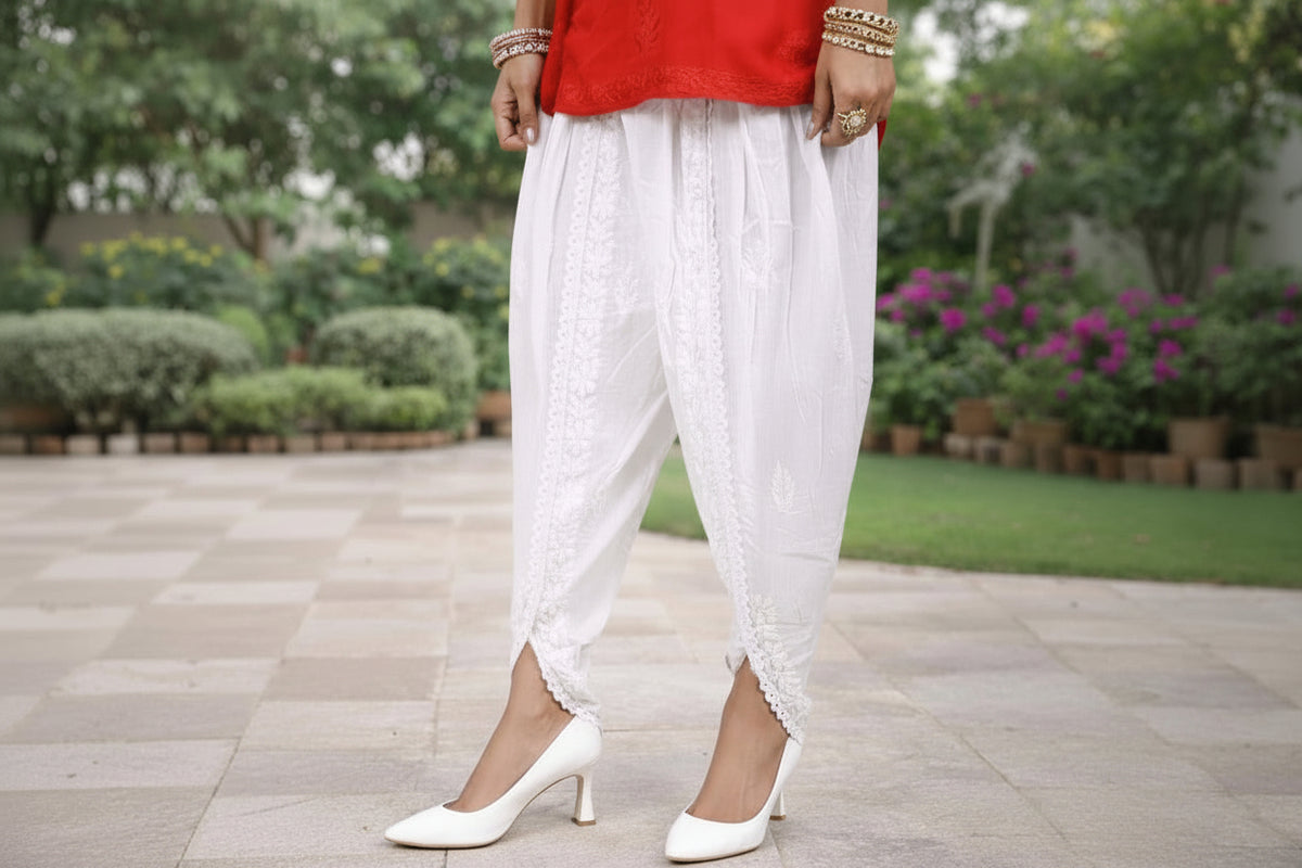 A white cotton fabric tulip hand embroidered salwar with elasticated waist